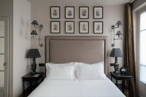 Hotel Saint-Louis en L'Isle - Notre-Dame客房内的一张或多张床位