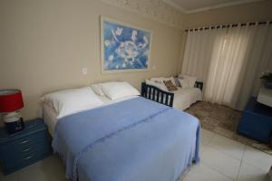 Recanto Villa REAL客房内的一张或多张床位