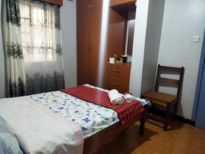 Half Acre Compound 1 Bedroom Residential Home客房内的一张或多张床位