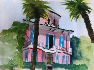 里诺迪莱吉诺Villa Maria Lago Maggiore的两棵棕榈树的粉红色建筑画