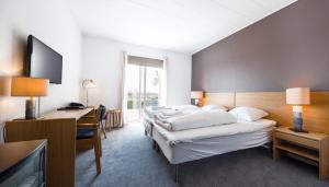 Møn Golf Resort - Hotel Præstekilde客房内的一张或多张床位