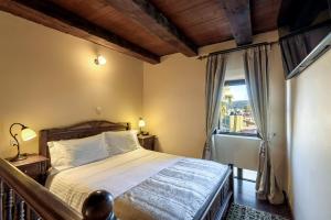 波尔图德尔科伦坡传统精品酒店客房内的一张或多张床位