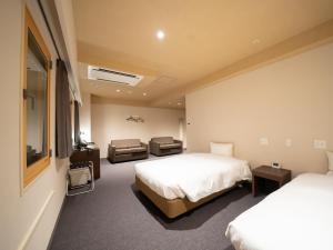 Shinsaibashi ARTY Inn客房内的一张或多张床位