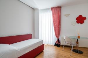 Santo Stefano Design Apartment by Wonderful Italy客房内的一张或多张床位
