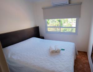 Regia Apartamentos Posadas客房内的一张或多张床位
