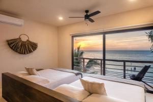 Hotel Boutique Casa Muuch Holbox - Solo Adultos客房内的一张或多张床位