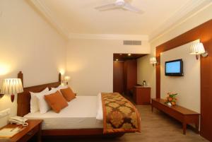 Chanakya Bnr Hotel客房内的一张或多张床位