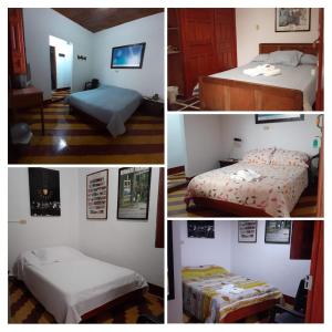 贾丁Hostal La Comedia的四张带两张床和一张桌子的卧室的照片