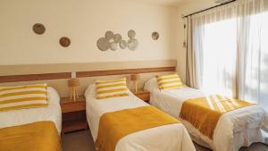 La Madrina Apart Hotel客房内的一张或多张床位