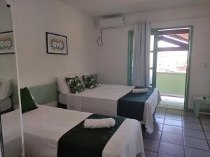 Hotel Porto Verde -JG客房内的一张或多张床位