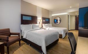 波哥大机场假日酒店客房内的一张或多张床位
