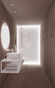 Moutsoúna奥斯特里亚旅馆的一间带两个盥洗盆的浴室和一个大窗户