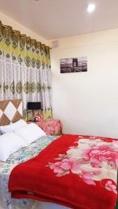 Hikal Guest House客房内的一张或多张床位