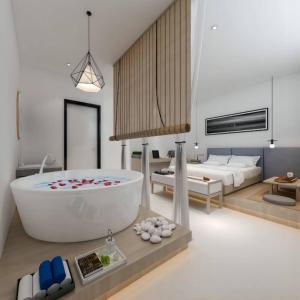 新加坡Rest Chinatown Hotel的带浴缸的浴室和卧室