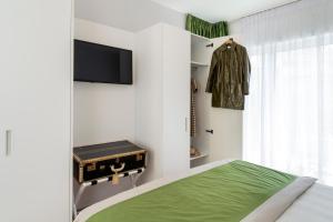 Appartamenti Vela Milano centro con garage客房内的一张或多张床位
