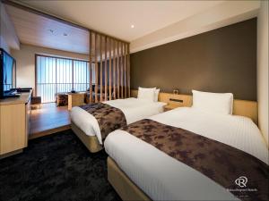 Daiwa Roynet Hotel Kyoto Ekimae PREMIER - former Daiwa Roynet Hotel Kyoto Ekimae客房内的一张或多张床位