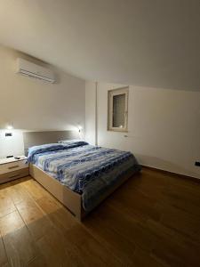 Terrazze Marinella - Appartamenti - Case vacanze客房内的一张或多张床位