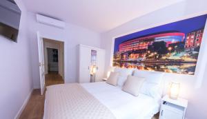 Bilbao Henao Park de Bilbao Suites, en pleno centro con garaje directo客房内的一张或多张床位