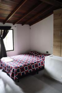 Lulú hostal客房内的一张或多张床位