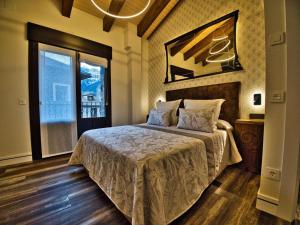 Apartamentos Valle de Ordesa-Torla客房内的一张或多张床位