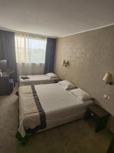 Rovno Hotel客房内的一张或多张床位
