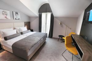 米莱尼耶酒店客房内的一张或多张床位