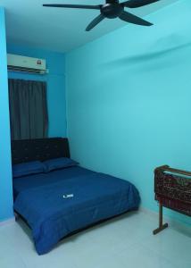 Homestay Layang客房内的一张或多张床位