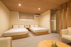 HOTEL All Stay Hakata Kukodori客房内的一张或多张床位