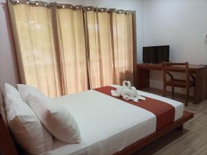 Portofino Panglao Bohol客房内的一张或多张床位