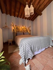 Borgo Al Canto Degli Alberi客房内的一张或多张床位