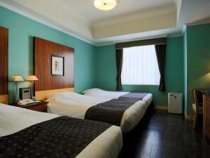 福冈蒙特利拉苏瑞酒店客房内的一张或多张床位