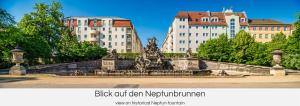 德累斯顿"Neptunblick"- Nähe Altstadt - Ruhig - Klinikum的一座公园内的喷泉,有建筑背景