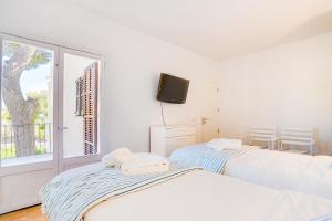 Ses Alzines Apartment - Costa De Los Pinos客房内的一张或多张床位