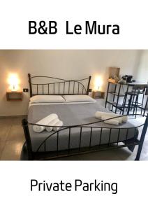 伊格莱西亚斯B&B Le Mura的一间卧室配有一张床铺,