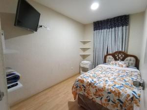 Peruvian Apartment客房内的一张或多张床位