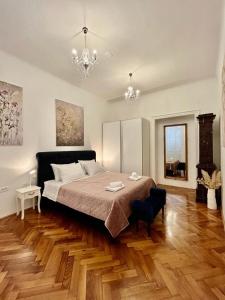 Lux Apartmans客房内的一张或多张床位