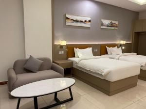 Season Inn Hotel_Al Hail客房内的一张或多张床位