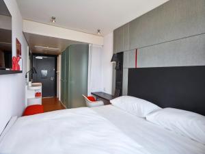 citizenM Seattle Pioneer Square客房内的一张或多张床位