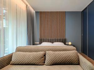 Comfy Rest apartamentai Kalno namuose客房内的一张或多张床位