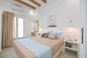 Elite Suites Naxos客房内的一张或多张床位