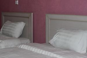 Lavina Hotel Apartments客房内的一张或多张床位