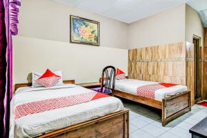 OYO 91053 Desa Wisata Gilimanuk客房内的一张或多张床位