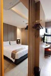 Hayo Hotel Palembang客房内的一张或多张床位