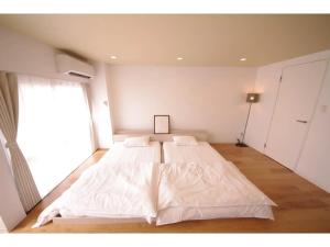 HOTEL APT SESELA - Vacation STAY 12881客房内的一张或多张床位