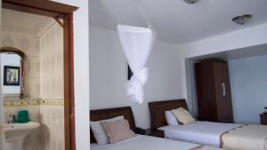 Océanis Hotel客房内的一张或多张床位