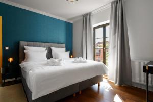 Hotel Waren-Alte Warener Zeitung客房内的一张或多张床位