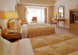 普瑞米尔米诺瓦酒店客房内的一张或多张床位