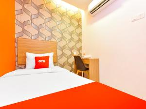 OYO 90511 Sovotel Kota Damansara 38a客房内的一张或多张床位