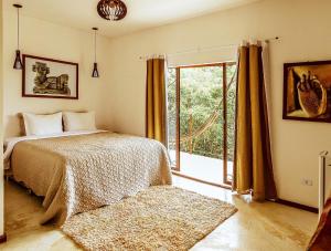 Pousada Casa de Shiva客房内的一张或多张床位