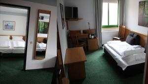 施普利瓦尔德贝斯特韦斯特酒店客房内的一张或多张床位